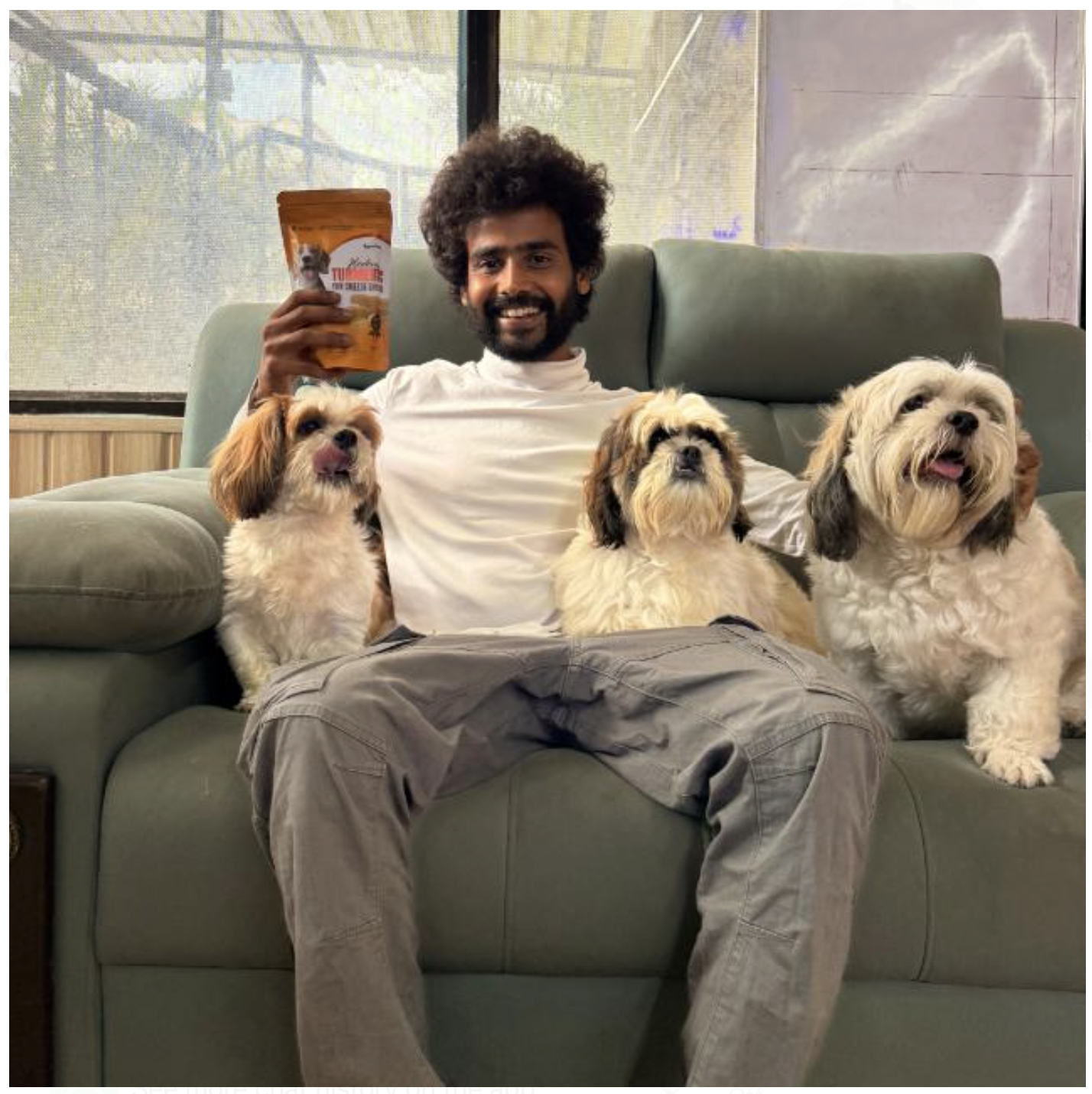 Divyanshu, Founder of IndoFolk Wellness, with his dogs